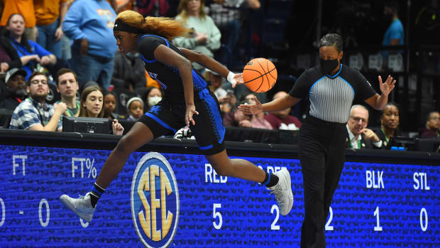 Kentucky Wildcats guard Rhyne Howard (10) saves the ball on the sideline during the first half against the Tennessee Lady Vols at Bridgestone Arena.